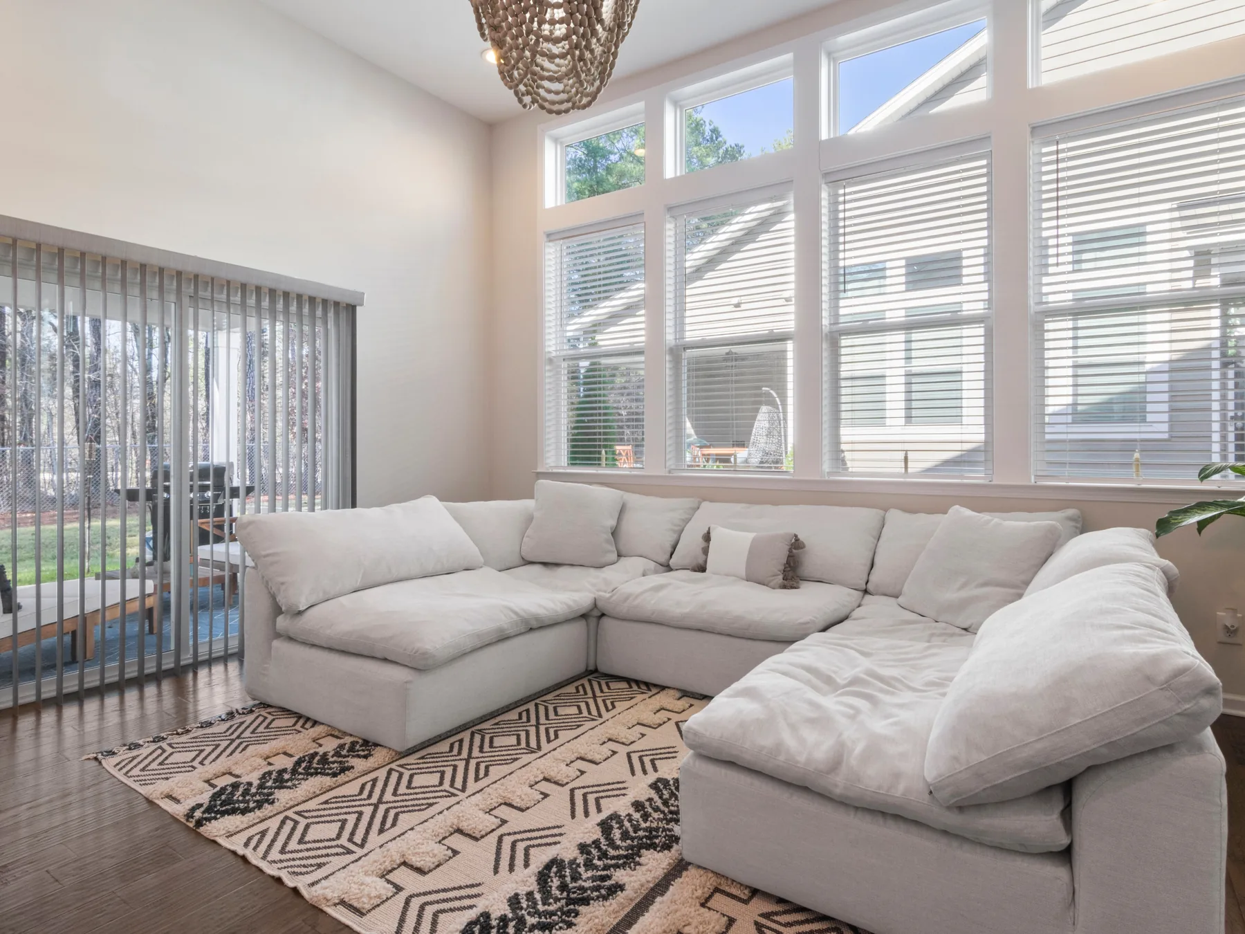 Large U-shaped sectional sofa occupying a bright living room corner